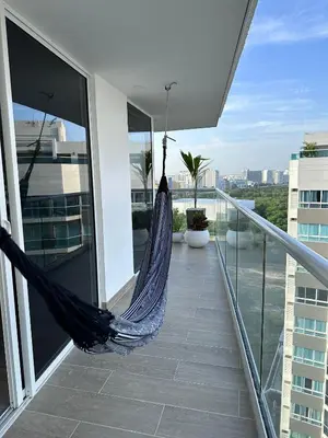 a hammock on the balcony of a building at DQ1301 | 2H Jacuzzi privado + piscina infinita in Cartagena de Indias