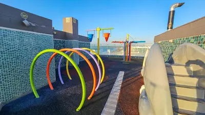 a playground with different colored hoses and surfboards at Hermoso apartamento con vista al mar in Cartagena de Indias
