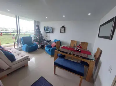 a living room with a table and a christmas tree at Apartamento Cartagena - Terrazas de Calicanto in Cartagena de Indias