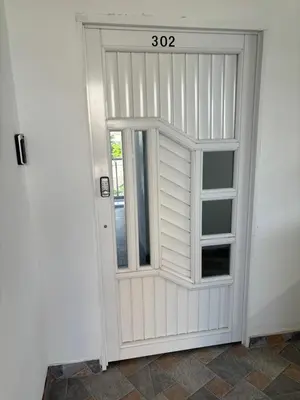 a door with a window in a room at Tropical Caribean Apartment in Cartagena de Indias