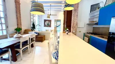 a kitchen with blue cabinets and a white counter top at Casa Lazuli 303 Cartagena in Cartagena de Indias