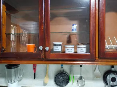 a wooden cabinet with three dishes in it at Hostal Renacer in Cartagena de Indias