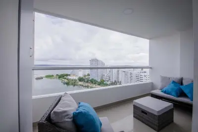a room with a large window with a view of the water at Exclusivo Apartamento con vista al mar in Cartagena de Indias