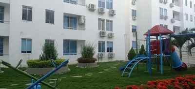 a playground in the courtyard of a building at Apartamento en Coveñas in Coveñas