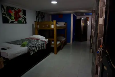 a room with two bunk beds and a hallway at Casa Tranquila in Cartagena de Indias