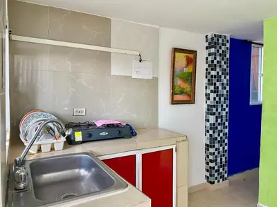 a kitchen with a sink and a counter top at Casa Tranquila in Cartagena de Indias