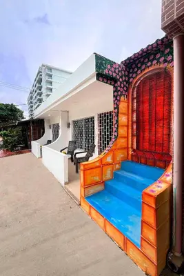 a house with a colorful staircase in front of it at Shekinah House in Cartagena de Indias