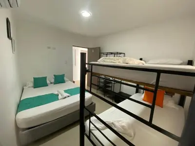 a room with two bunk beds in it at Shekinah House in Cartagena de Indias