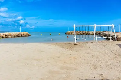 an empty beach with an empty goal in the sand at Villa con piscina privada en coveñas sucre in Coveñas