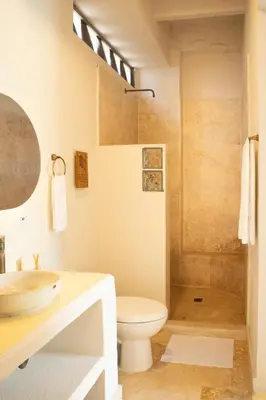 a bathroom with a sink and a toilet and a shower at Villa con piscina privada en coveñas sucre in Coveñas