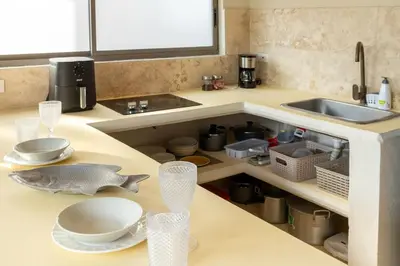 a kitchen counter with a sink and a fish on it at Villa privada en coveñas sucre in Coveñas