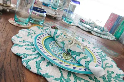 a plate on top of a wooden table at Isla Pelícano in Isla Grande