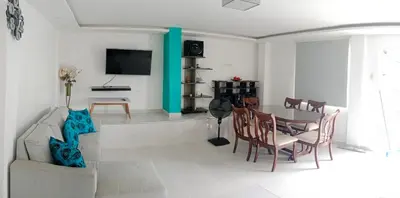 a living room with a couch and a table at Casa Topacio in Cartagena de Indias
