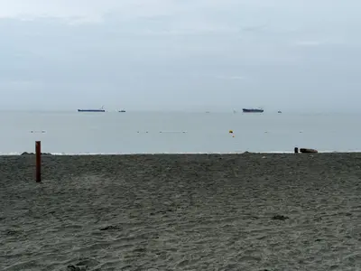 a sandy beach with the ocean in the background at Apartamento en Pozos Colorados Santa Marta Suite 1309 -Pozos Colorados in Santa Marta
