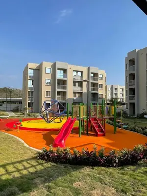 a playground in a park with a slide at Apartamento Cartagena cerca a la playa in Cartagena de Indias