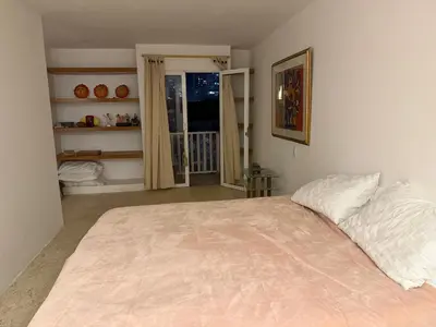 a bedroom with a large bed and a window at Apartamento en Las Bovedas in Cartagena de Indias