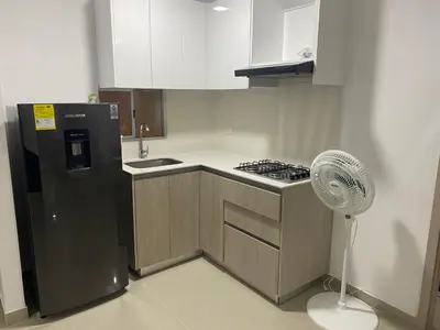 a kitchen with a refrigerator and a fan at Apartamento Amoblado en Cartagena in Cartagena de Indias