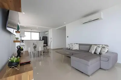 a living room with a couch and a table at Awesome Sea View and Historic Center “Morros City” in Cartagena de Indias