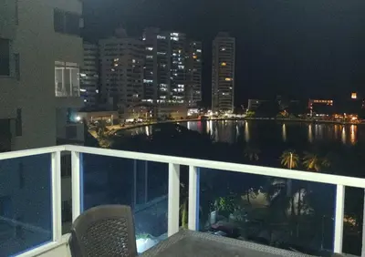 a balcony with a view of the city at night at Balcón del mar in Cartagena de Indias