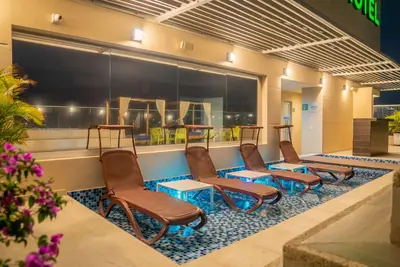 a row of chairs sitting in a waiting room at Wyndham Garden Barranquilla in Barranquilla