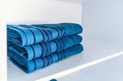 a stack of blue towels on a shelf at Cartagena Paradise Beach Home Sleeps 7 in Cartagena de Indias