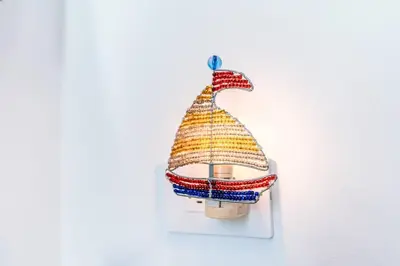 a crochet ornament of a christmas tree on a wall at Cartagena Paradise Beach Home Sleeps 7 in Cartagena de Indias