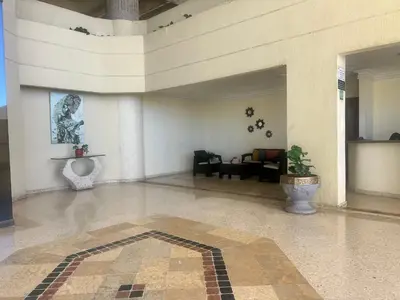 a large room with a lobby with a plant in it at Apartamento con vista al mar Cartagena piscina in Cartagena de Indias
