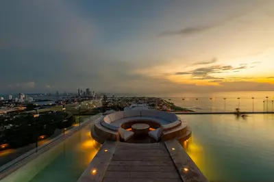 a view of a city and the water at sunset at Espectacular Vista al Mar and Historic Center 2BR in Cartagena de Indias
