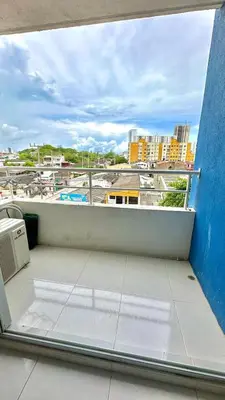 a balcony with a view of a city at Apartamento amoblado cerca al mar in Cartagena de Indias