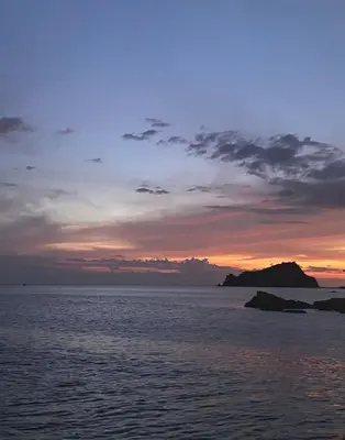 a sunset over a body of water at Apartamento LOFT INFINITY BLUE in Santa Marta