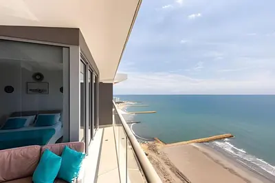 a balcony with a view of the ocean at Vista al Mar y Centro Histórico “Morros City” 26fl in Cartagena de Indias
