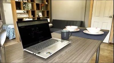 a laptop computer sitting on top of a table at A 5 mins de CC único King, Aire, Wi-Fi, Cocina in La Mina