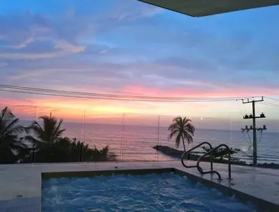 a swimming pool with a view of the ocean at Luxury Apartment - Stunning Sea View in Cartagena de Indias