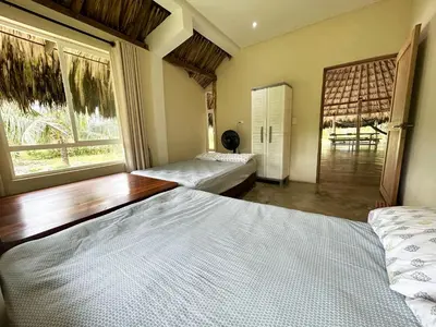 a bedroom with two beds and a window at La Felicidá in Cartagena de Indias