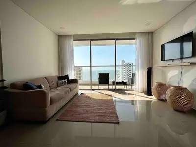 a living room with a couch and a large window at CasaMaha Cartagena Espectacular Apartamento in Cartagena de Indias