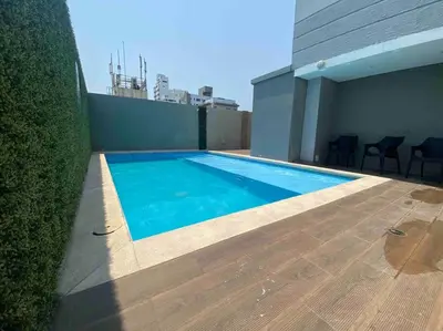 a swimming pool on the roof of a building at Fantástico apartamento entero en el norte de la ciudad in Barranquilla