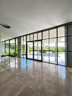 an empty room with large windows and a large floor to ceiling glass wall at Lujo y relax frente al mar en Morros Eos in Cartagena de Indias
