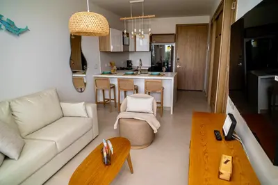 a living room with a couch and a table at Exclusivo Apartamento en Baia Kristal 1 hab in Cartagena de Indias