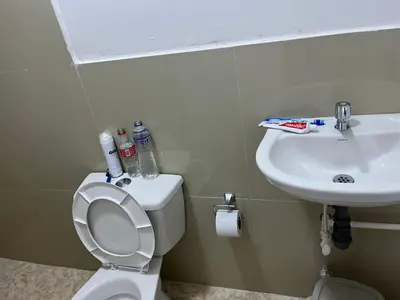 a small bathroom with a toilet and a sink at Hostel HA1 in Cartagena de Indias