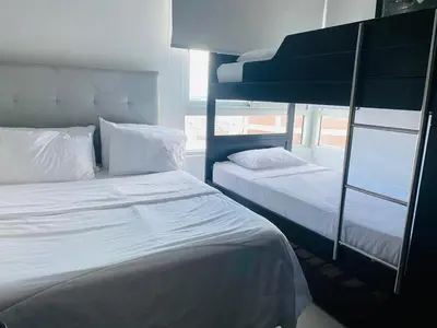 a bedroom with two bunk beds and a window at Apto 2301 vista al mar Palmetto elíptic in Cartagena de Indias