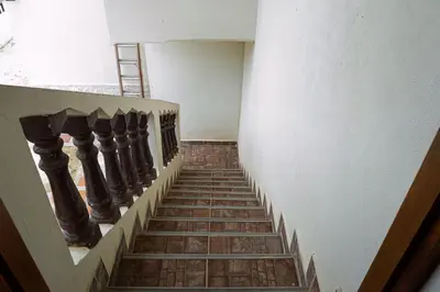 a stairway with a spiral staircase in a building at Alojamiento Familiar #4 - El mejor mar y playas in Puerto Viejo