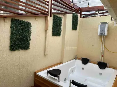 a bathroom with a bath tub and a sink at Beautiful house en el centro in Cartagena de Indias