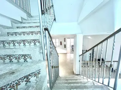 a staircase in a house with white walls and white floors at Private House - 4 Pisos - 100 Mts de la playa in Cartagena de Indias