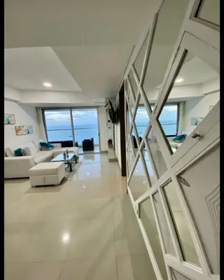 a living room with a view of the ocean at Palmetto Eliptic in Cartagena de Indias
