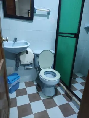 a bathroom with a toilet and a sink at Hotel Tamaulipas Mixteca in Sincelejo
