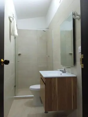 a bathroom with a toilet and a sink and a shower at Casa de Huesped Sky Blue Barranquilla Colombia in Ciudad Jardín