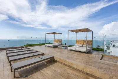 a group of benches sitting on top of a building at Beachfront Condo 1605 Murano Centro 1, Near Walled City Airport Pick Up in Cartagena de Indias