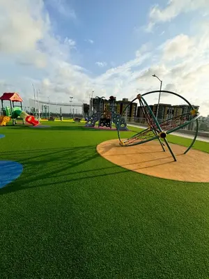 a park with a playground with a swing at Apartamento La Plazuela Barranquilla in Barranquilla
