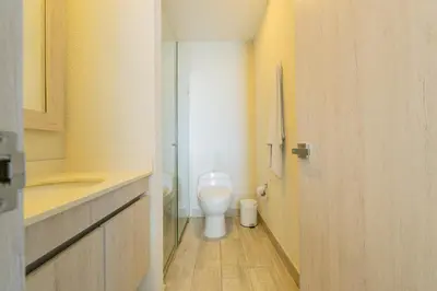 a small bathroom with a toilet and a sink at Dominique 1101 - Espectacular Apto con Jacuzzi in Cartagena de Indias