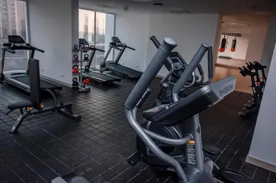 a gym with several tread machines in a room at Porto Horizonte Suite 735 in Santa Marta